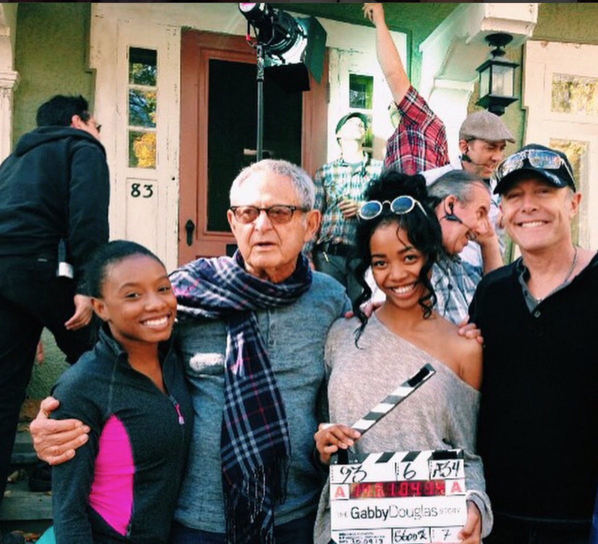 Kyal Legend with Imani Hakim, producer Zev Braun, and Director Gregg Champion on set of 