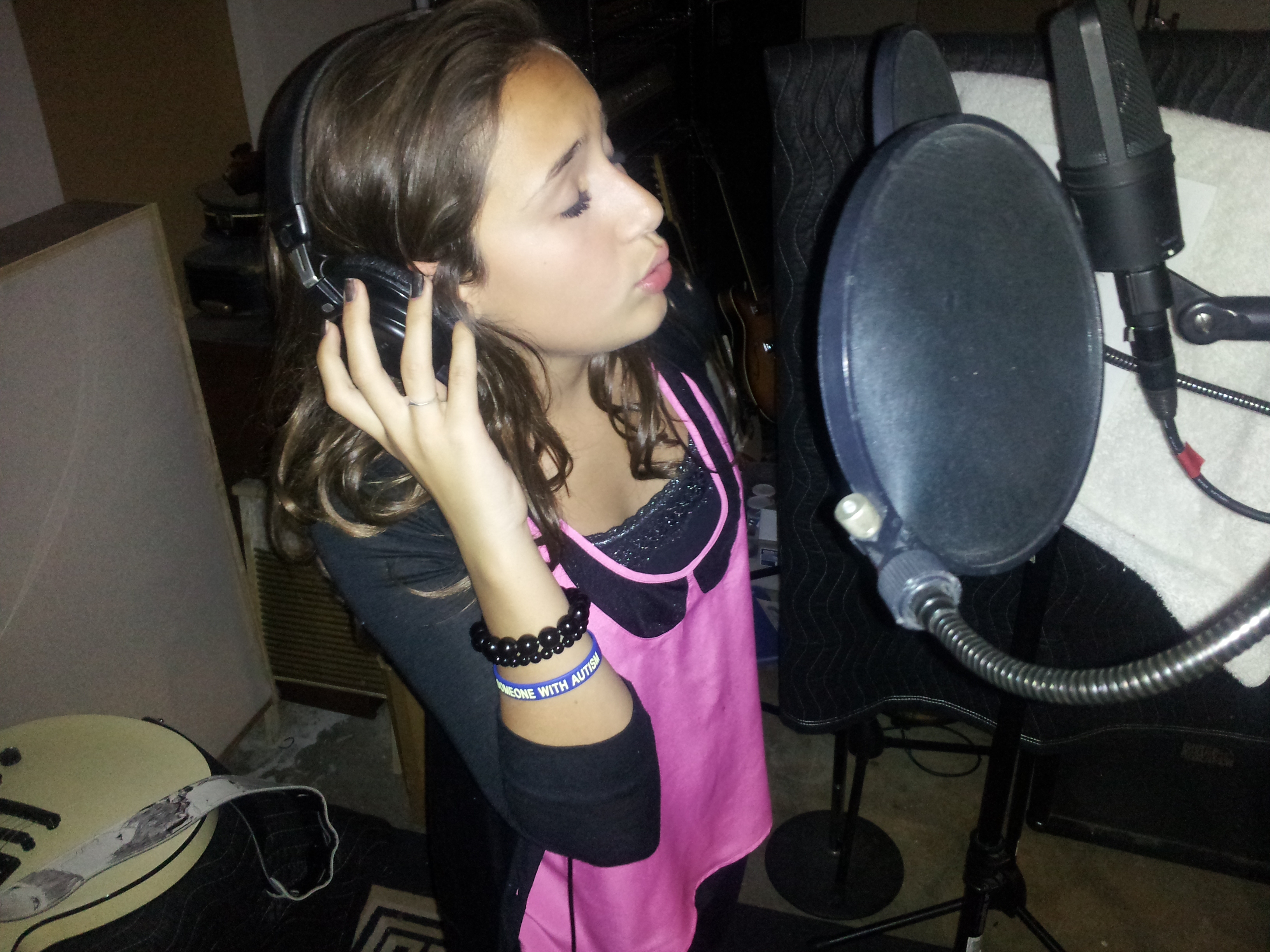 Ariana recording a song.