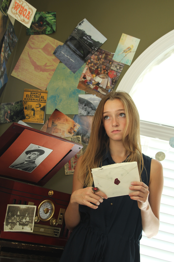 Natalie Saint-Martin holds a letter from her far-away-friend in 