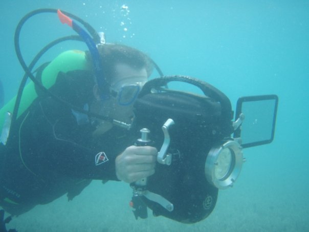 Producer/Director operates a 16mm bolex camera 40ft below the surface of the Atlantic Ocean on location in Bermuda.