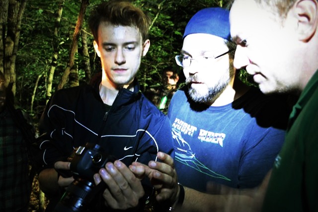 Director John Holt, cameraman Daniel Yocum and writer Jason Turner review footage.