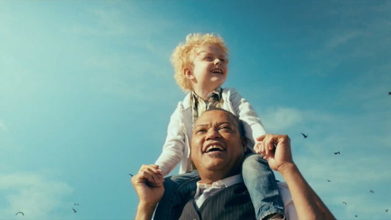 (from bottom) Laurence Fishburne and Christian Ganiere - Tele 2 - HBO Being Frank riding on his shoulders at the beach 2