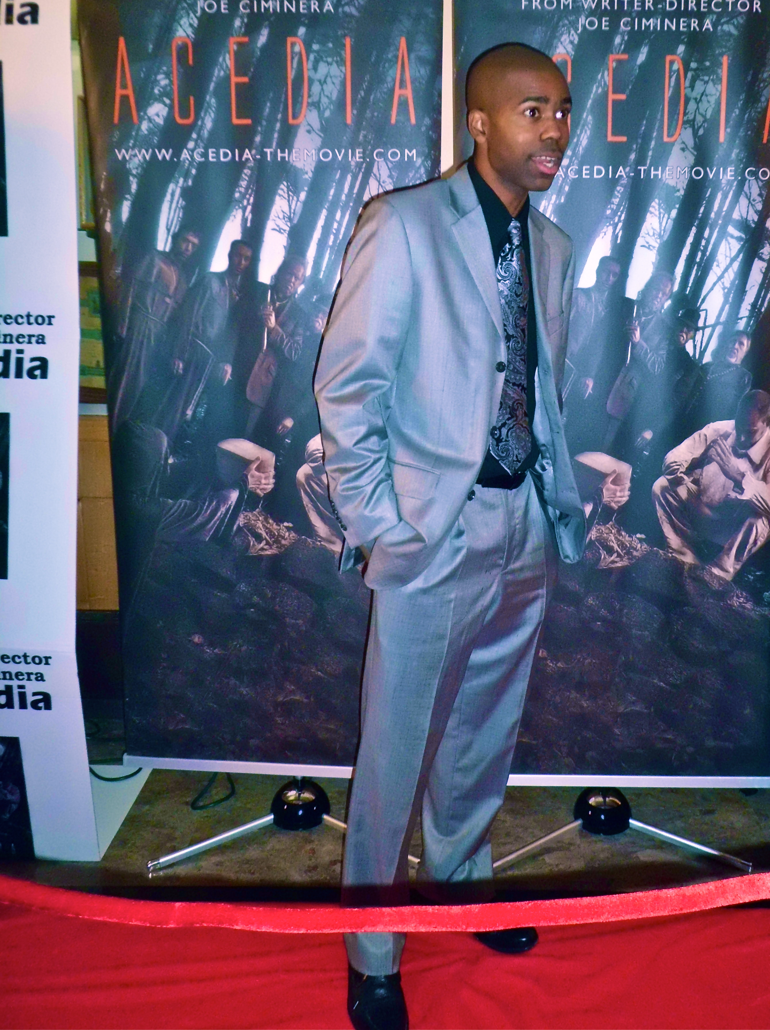 director Michael Ray poses for paparazzi on the red carpet at October 2012 Acedia movie premiere in NYC