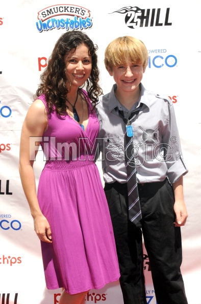 HOLLYWOOD, CA - JUNE 23: Actress Casey Dacanay and actor Nathan Gamble arrive for '25 Hill' - Los Angeles Premiere And Soap Box Race held at American Cinematheque's Egyptian Theatre on June 23, 2012 in Hollywood, California. (Photo by Alber