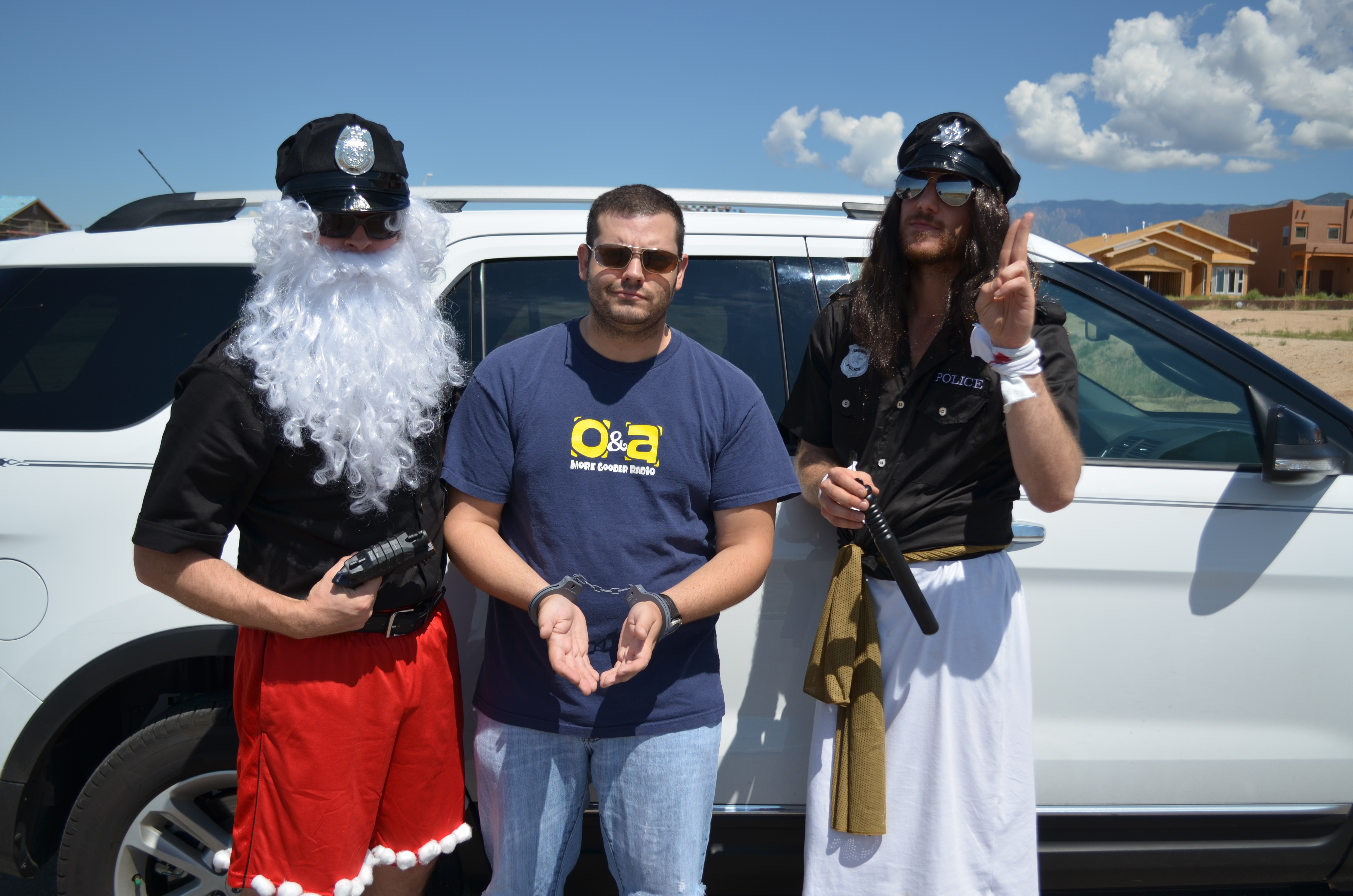 Nathan Brimmer as 'Sgt Cringle', Barry R. White as 'Naughty Perp', and Adam Luaces as 'Officer Christ' in 