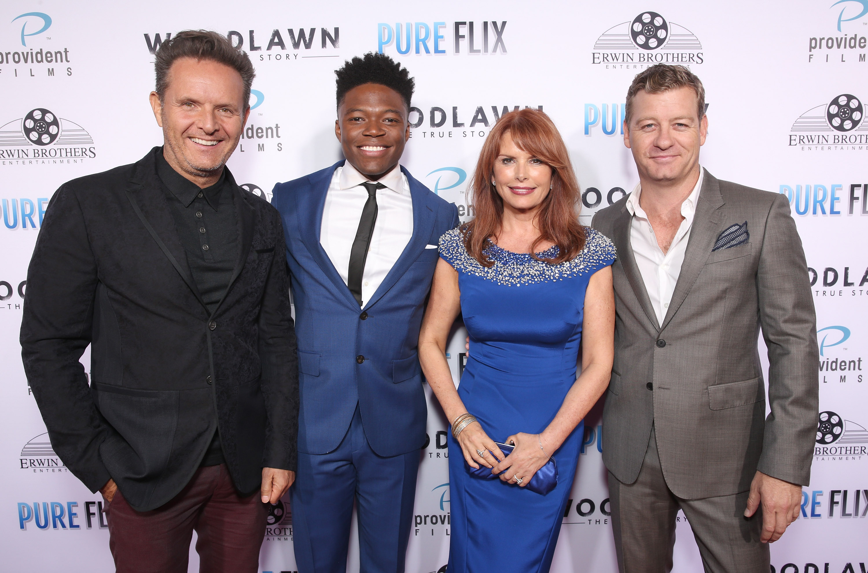 Still of Mark Burnett, Caleb Castille, Roma Downey, and Nic Bishop at the WOODLAWN premiere, at the Bruin Theatre. Westwood, CA. Monday October 5th 2015