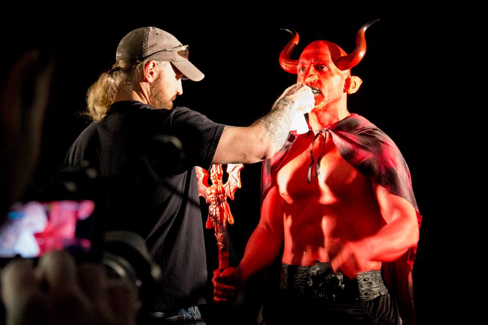 Johnny Collins doing make-up on actor Gilbrando Acevedo in 