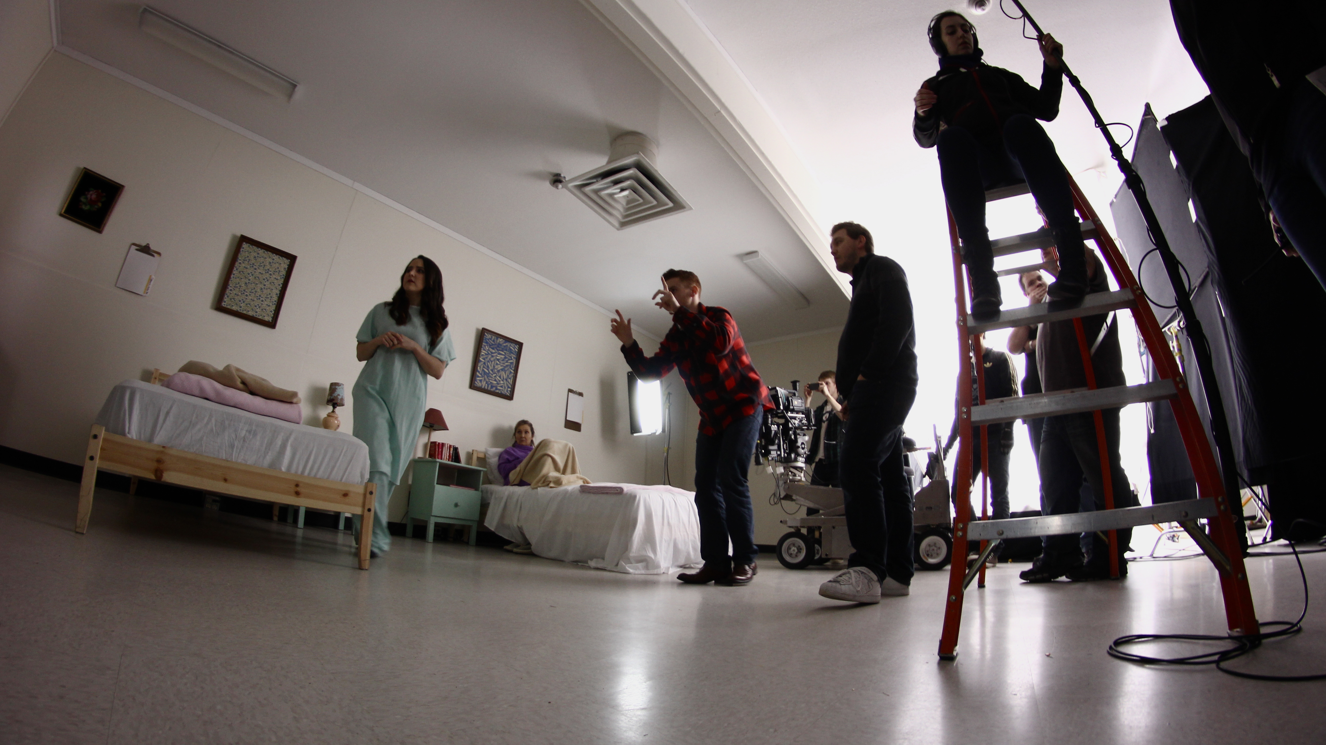 Nigel Edwards blocking a scene with PLynn Johnson and Laura Geluch.