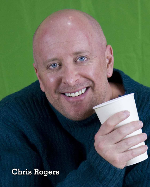Chris Rogers smiling with coffee cup.