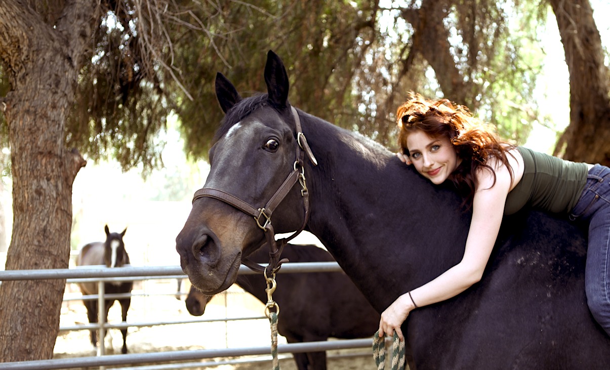 Suzanne LaChasse and her rescued racehorse, Pyro, on her family's ranch.