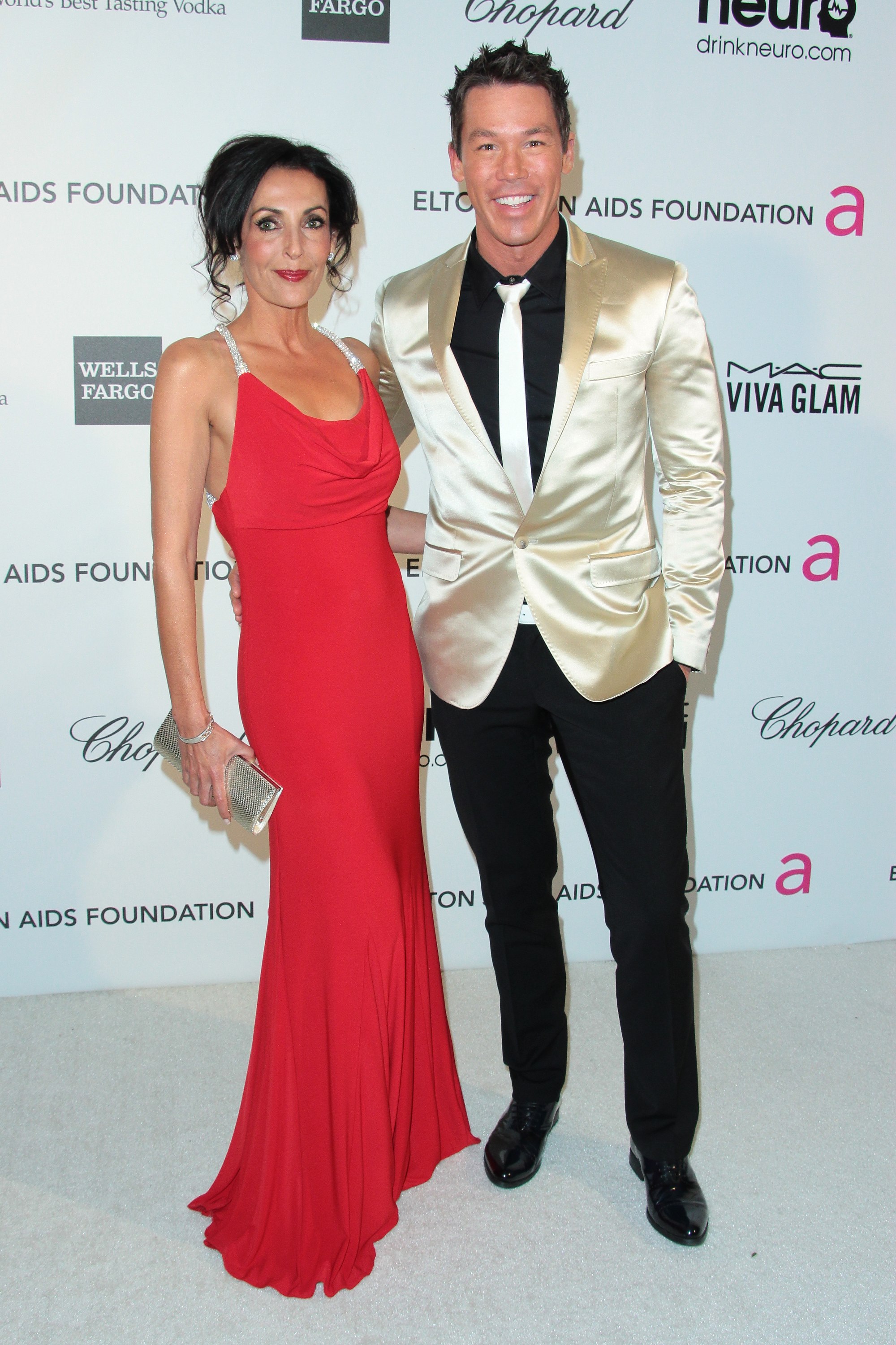 Ghada Dergham and David Bromstad arrive at the Elton John AIDS Foundation Academy Awards Viewing Party