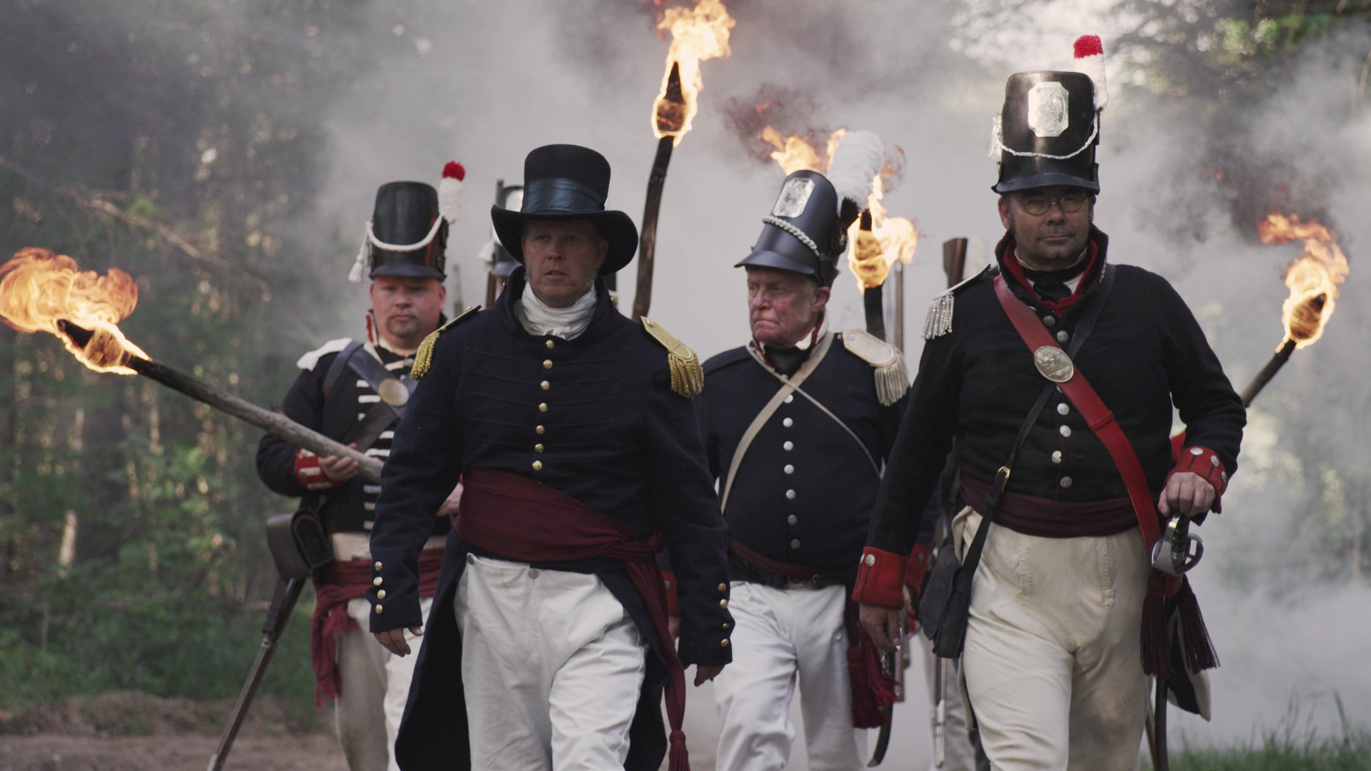 Abraham Markle (Doug Clark) of the Canadian Volunteers leads American raiders through the town of Dover Mills.