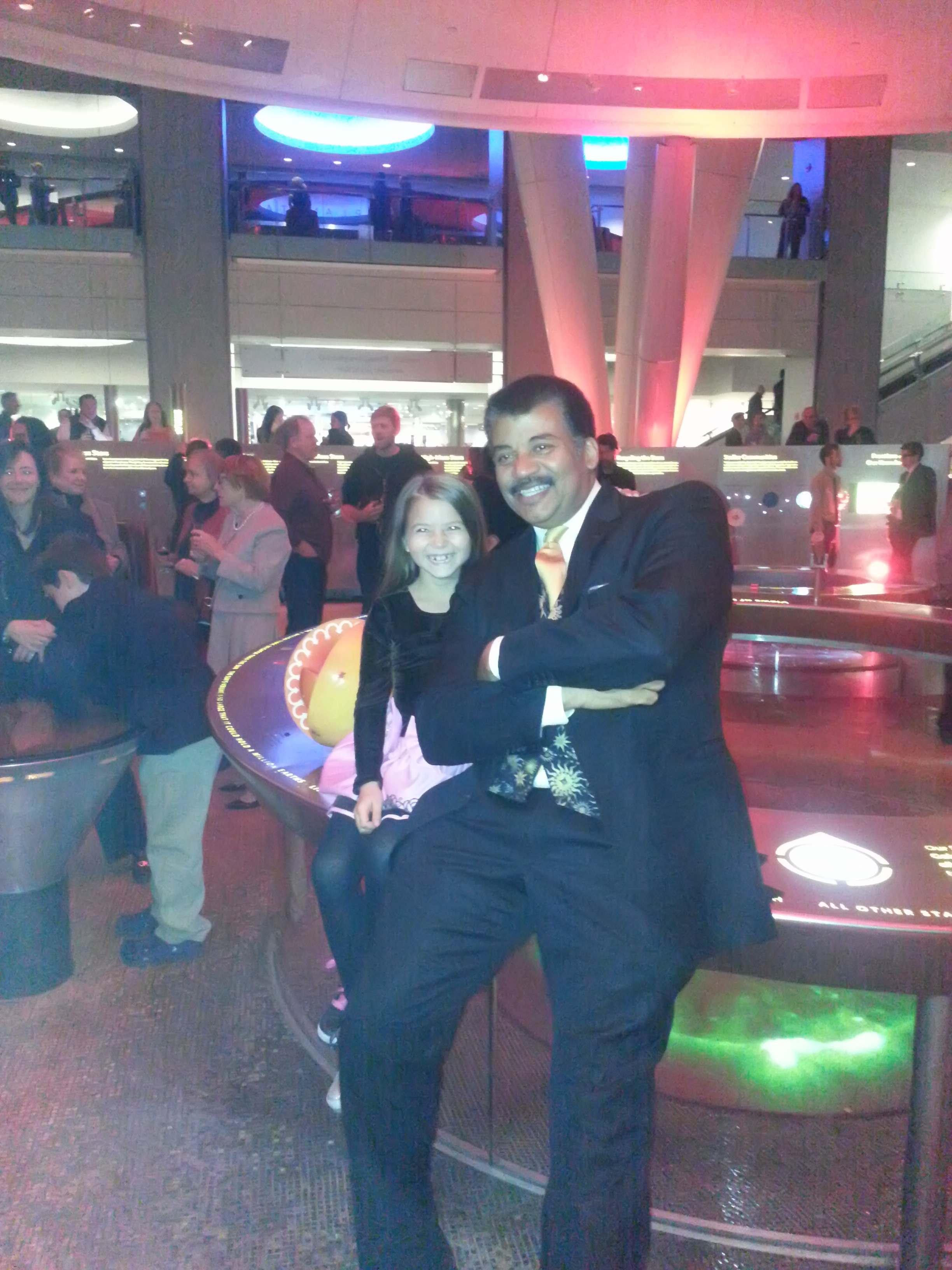 Accalia Quintana with Neil deGrasse Tyson at the Hayden Planetarium 