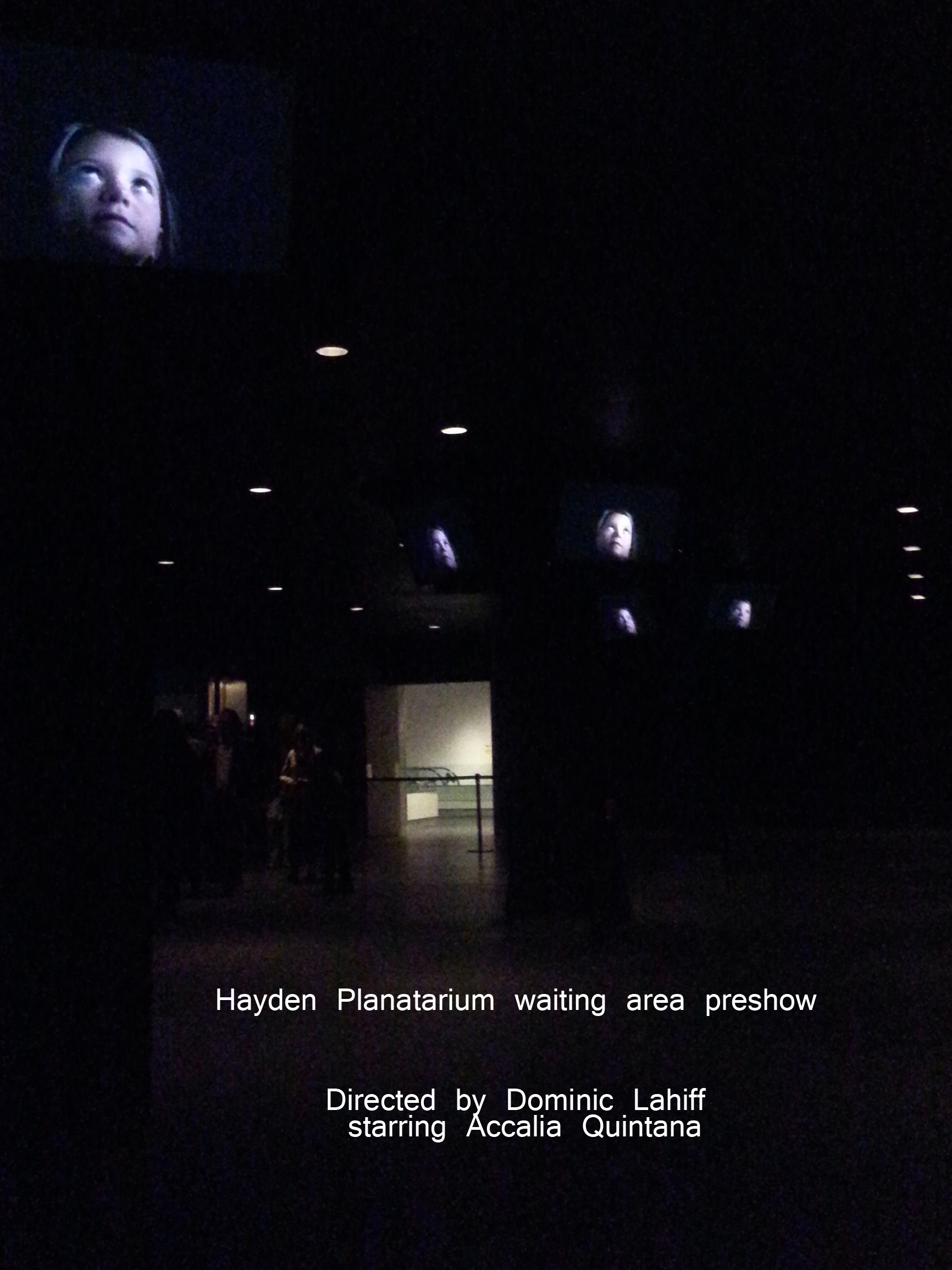 Hayden Planetarium waiting area preshow. Multiple screens of CaliQ