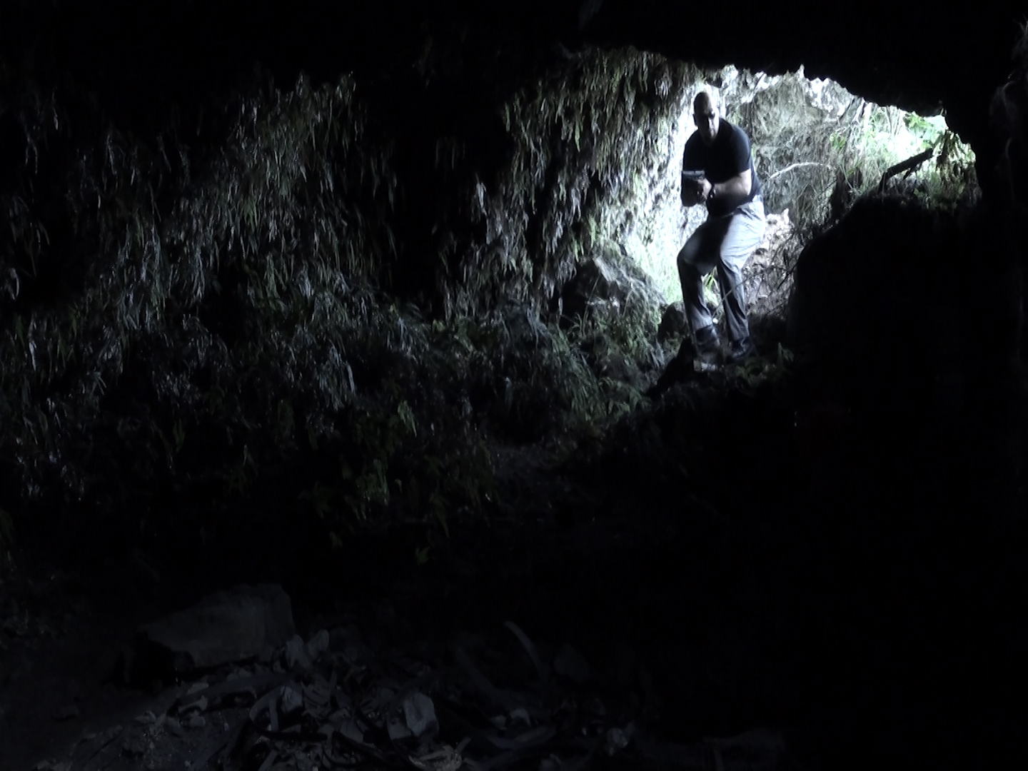 Bullitt (Richard Gonzalez) enters the cave chasing after Dr. Florez