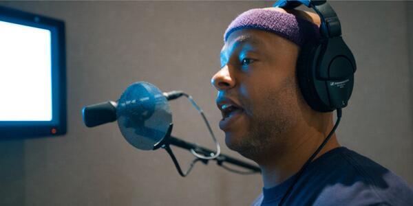 Arif S. Kinchen in the booth while recording 