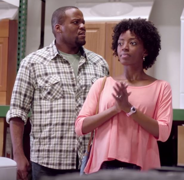 A husband (R. Charles Wilkerson) and wife (Tiffany Renee Johnson) are at a hardware store looking at appliances. After wandering the aisles, the only expert they can find is from the fertilizer department.