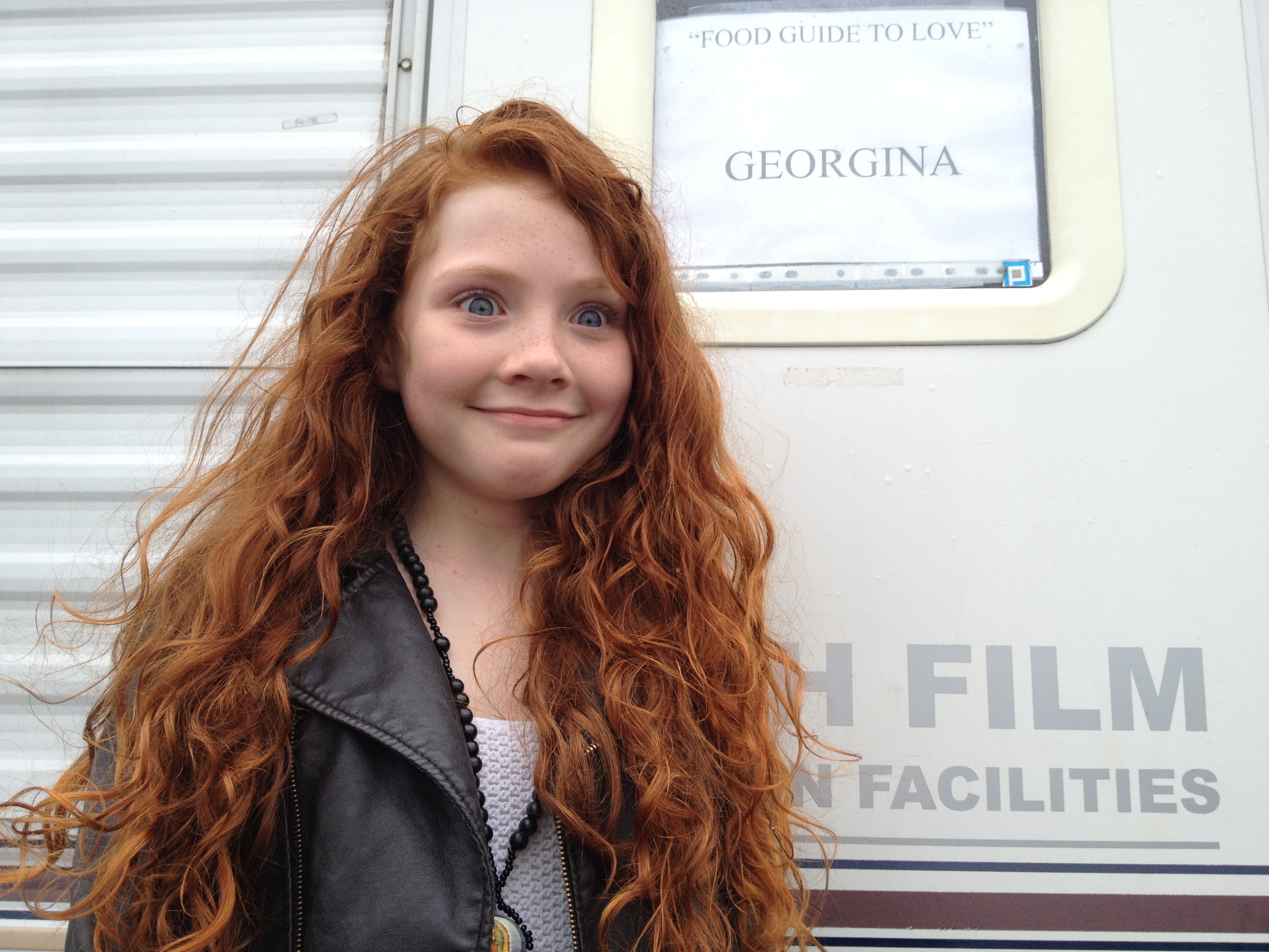 Very excited at the sight of her own mobile on the film set playing Young Georgina in 'Food Guide to Love' 2012!