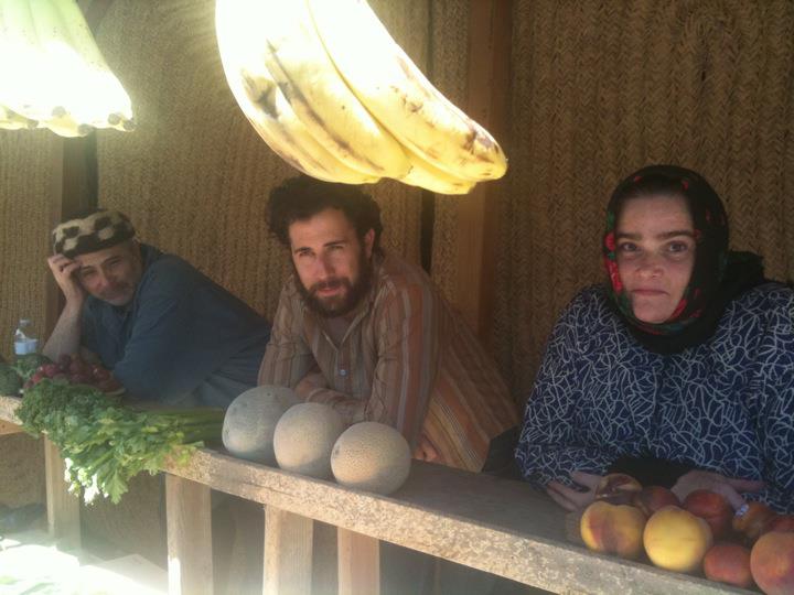 The Husseini Family: Pops, Hassan, and Cousin Fahimeh in the Husseini Flower, Fruit, and Vegetable Stand in Neka, Iran. Behind the Scenes shot from the filming of For The Birds [ 2014 ]  with Jon Raymond and Rafael Zubizarreta Jr.