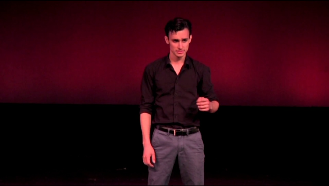Still of Marco Svistalski performing his one-man show, 