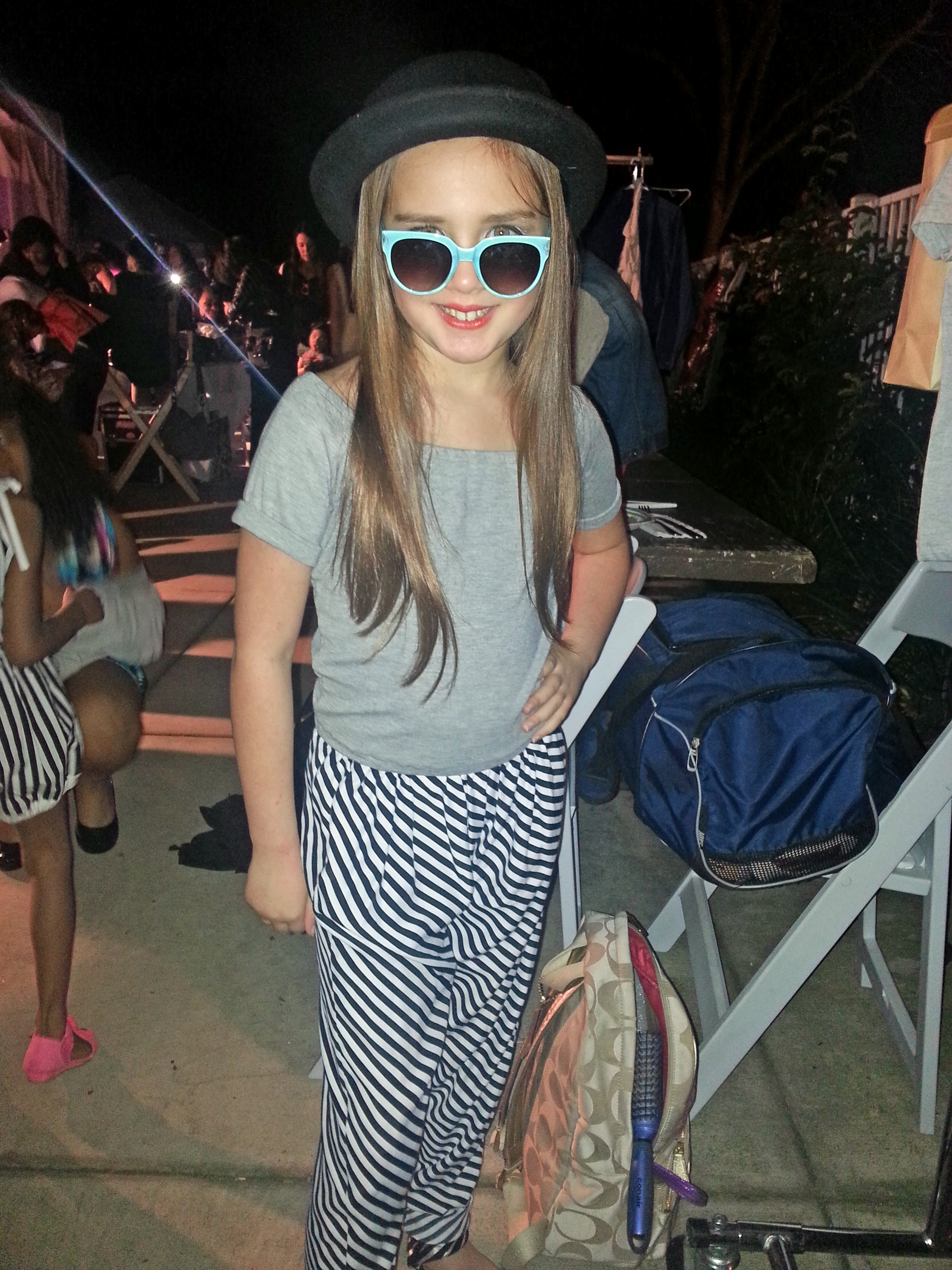 Hannah modeling an outfit from Sweet Threads at the Long Beach Fashion Show