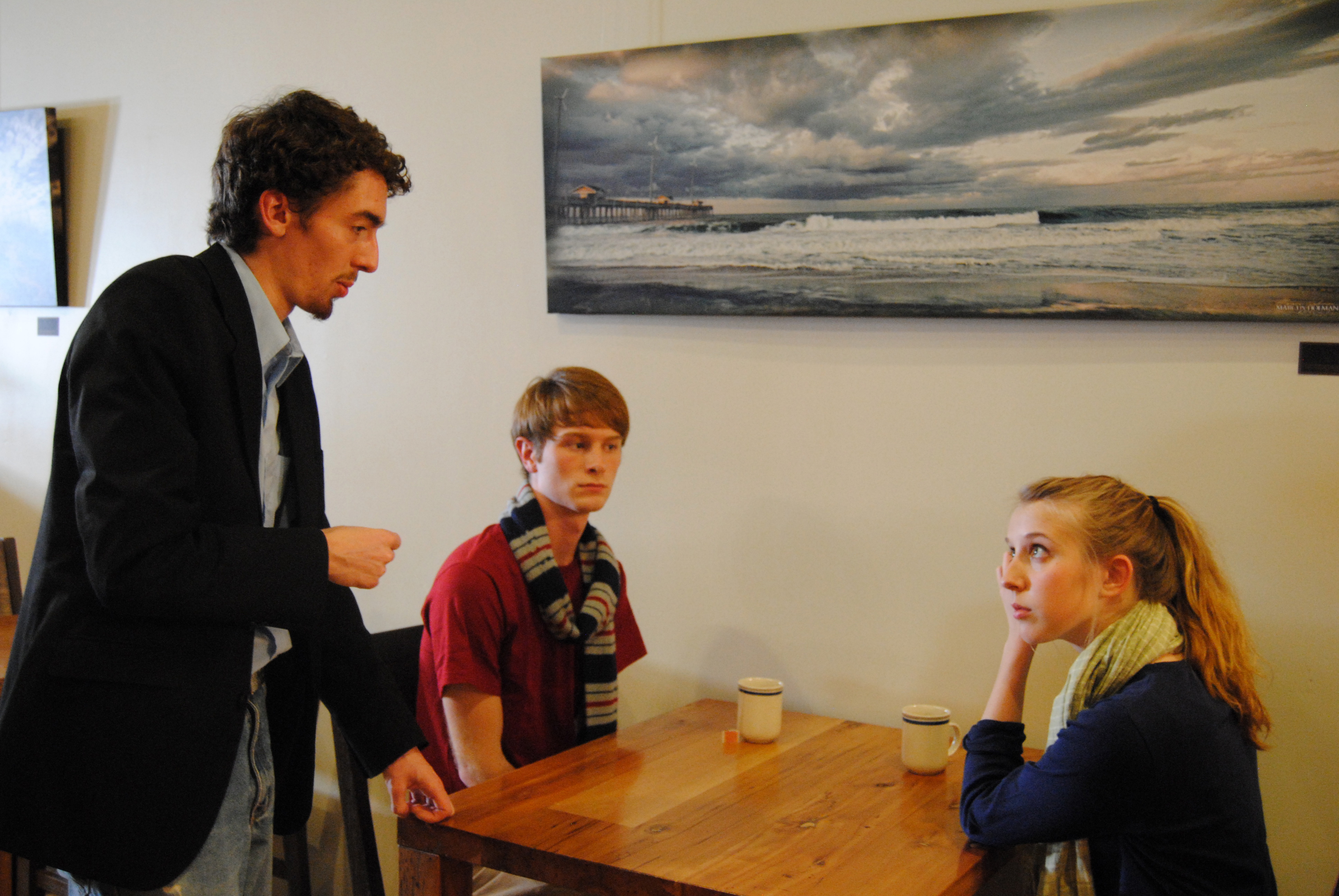 Director Blake Cortright [L] works with actress Samantha O'Dell [R] and Zach Phaneuf [M] between takes on the set of Spilled Tea (2013).