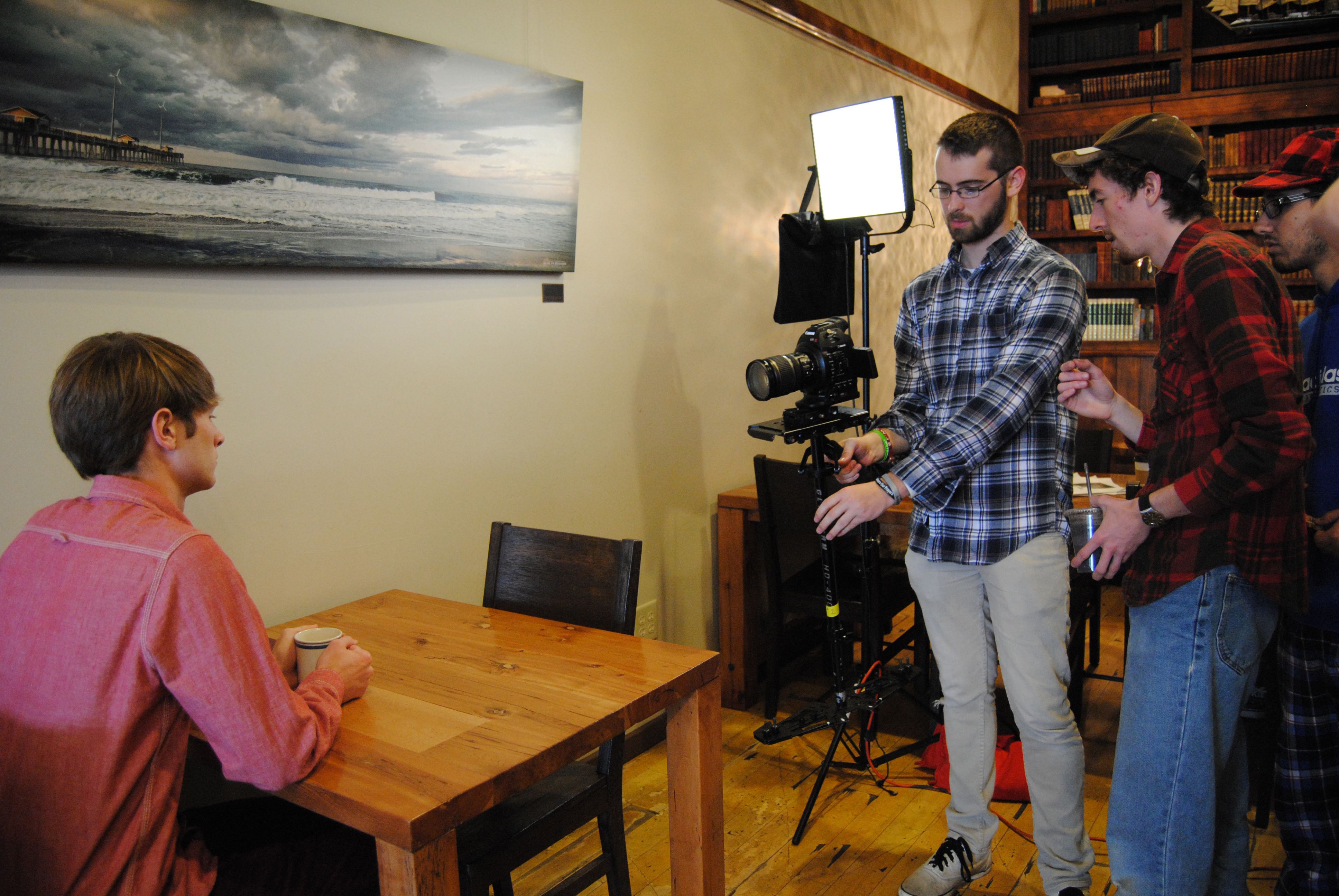 Director Blake Cortright [R] walks through a glide cam shot with Director of Photography Josiah Blizzard [M] on the set of Spilled Tea (2013).