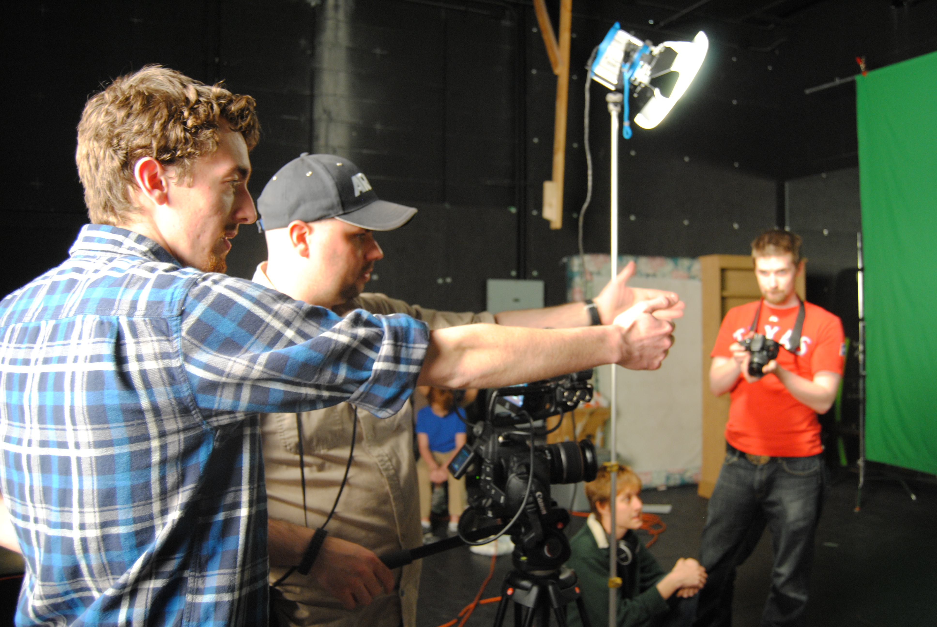 Director Blake Cortright [L] discusses the shot with Director of Photography Michael Hammond [M] on the set of 