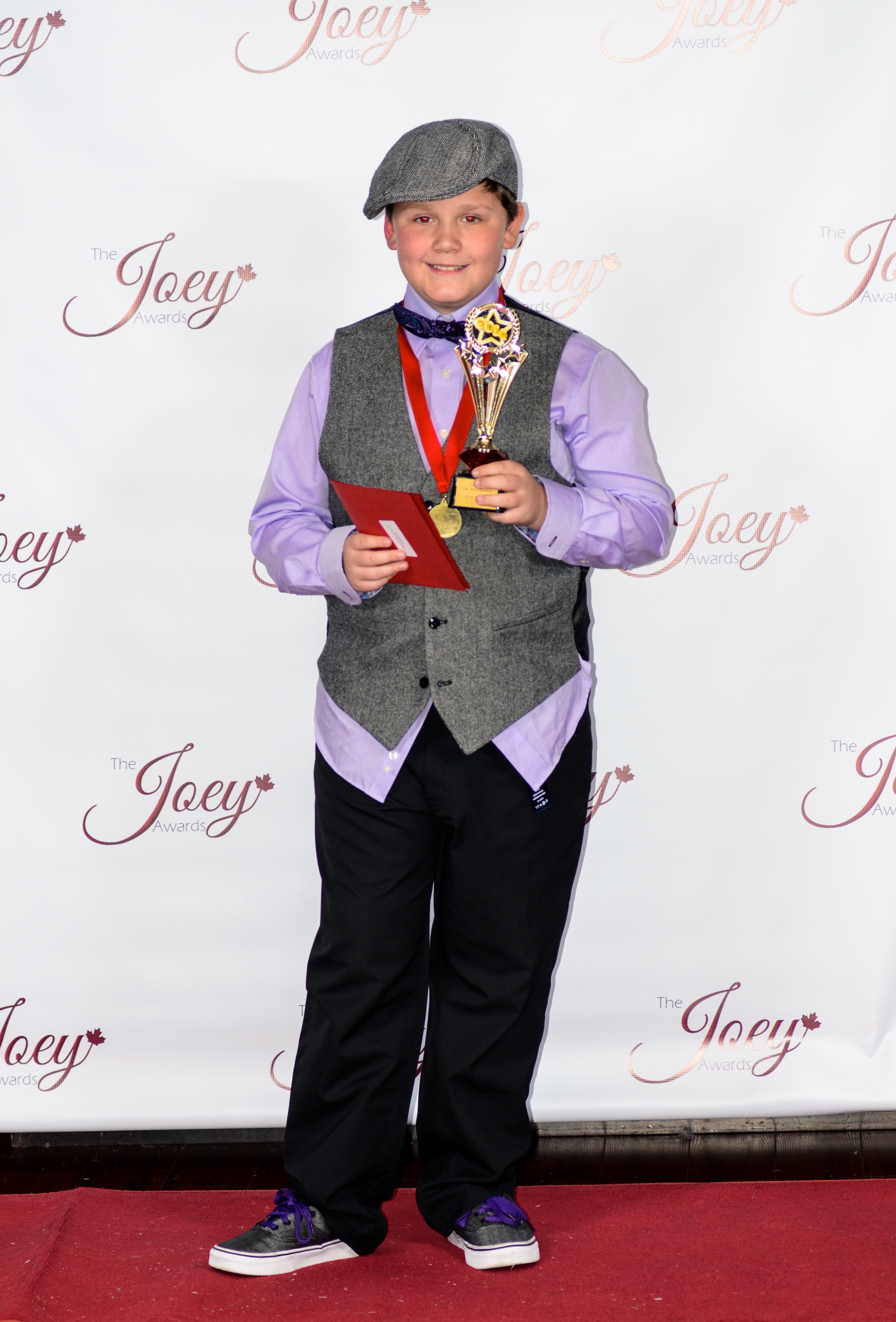 CJ with his 2014 Joey Award win for best young actor in a TV commercial