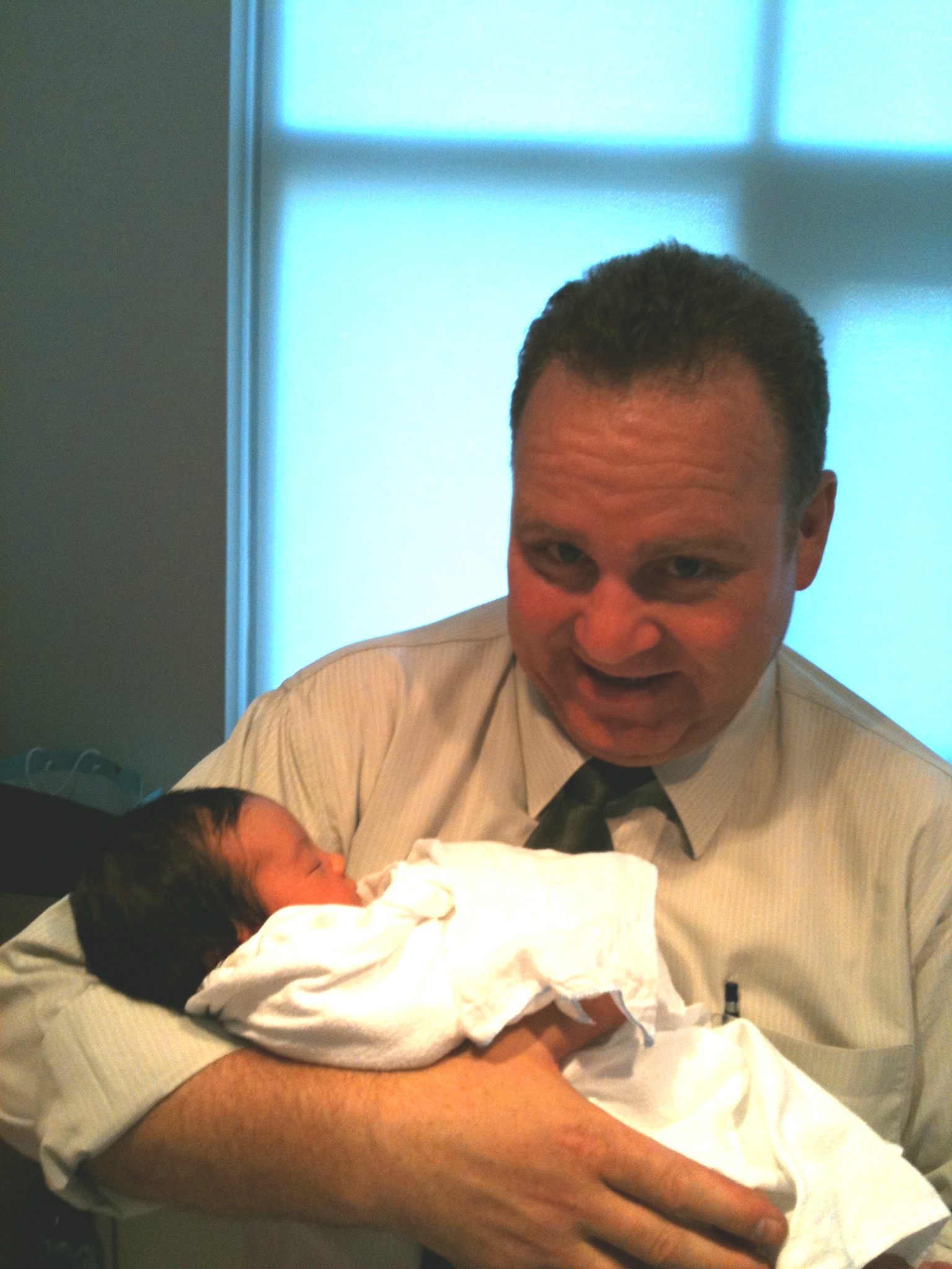 A star is born! Dean Dawson holding newborn baby Julia Rhodes.