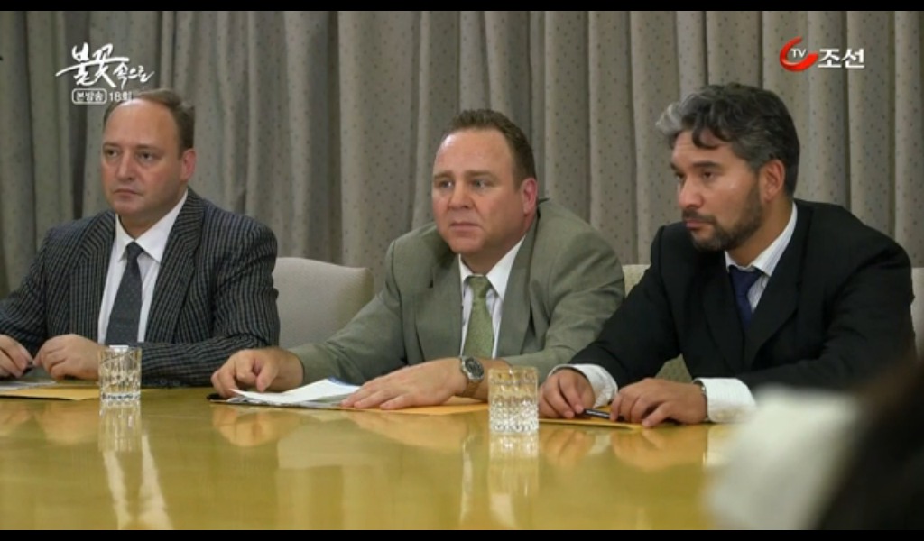 Still of Dean Dawson (center) as President Hunt on Into the Flames for Chosun Television.