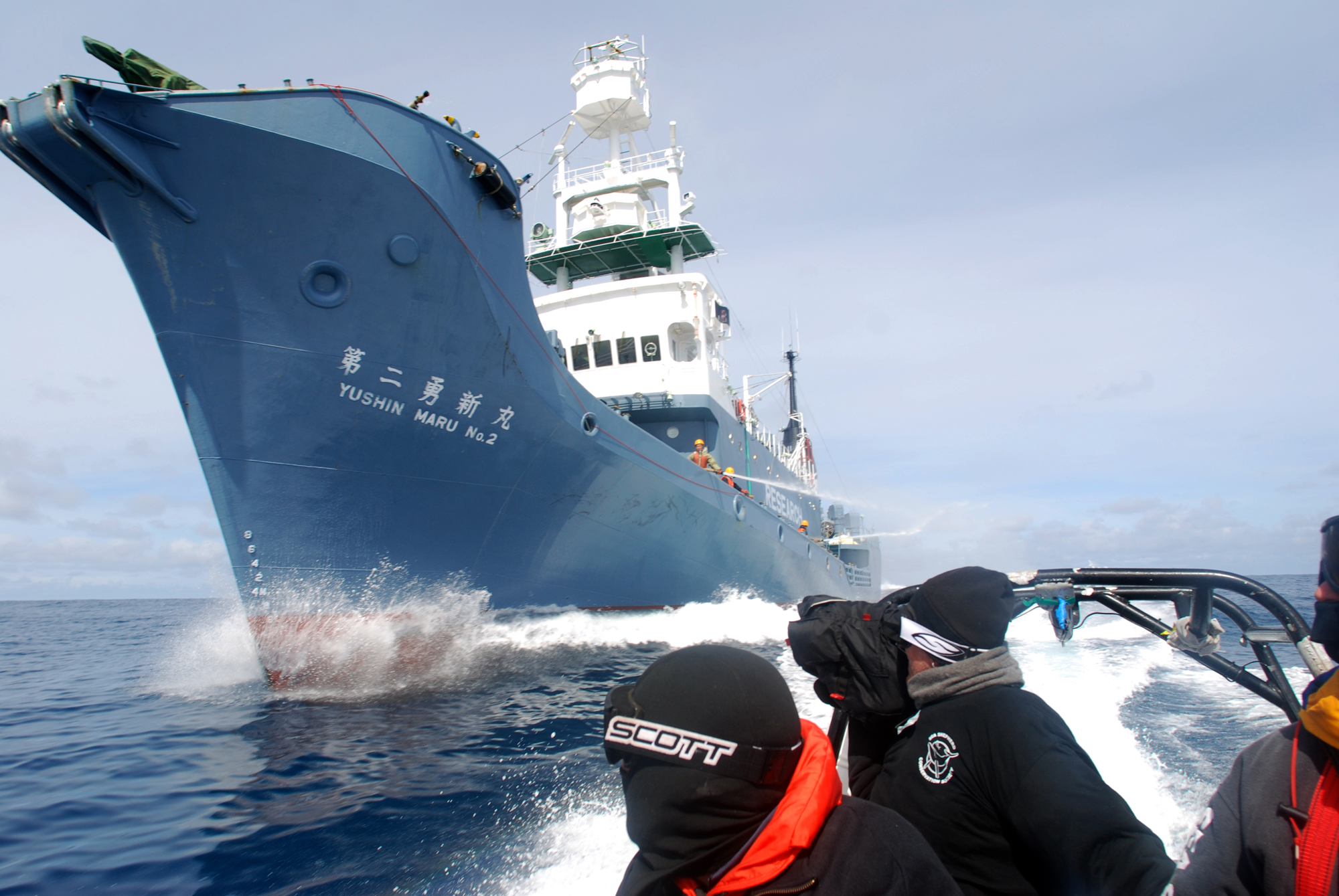 Whale Wars - Season 1 Field Producer and series D.P., Robert Case shoots as Boson Dave and Boson's mate Riccy maneuver under the bows of the Yushin Maru No. 2