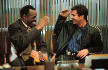 Riggs and Murtaugh in the captain's office
