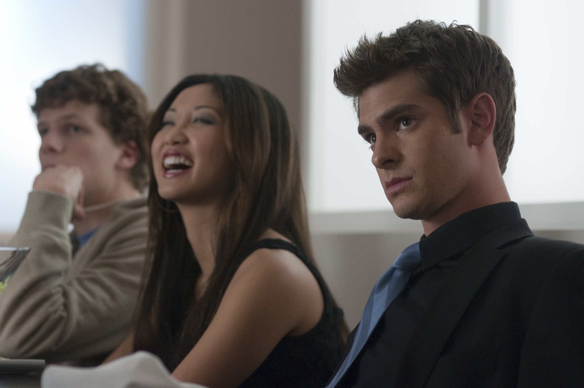 Still of Jesse Eisenberg, Brenda Song and Andrew Garfield in The Social Network (2010)