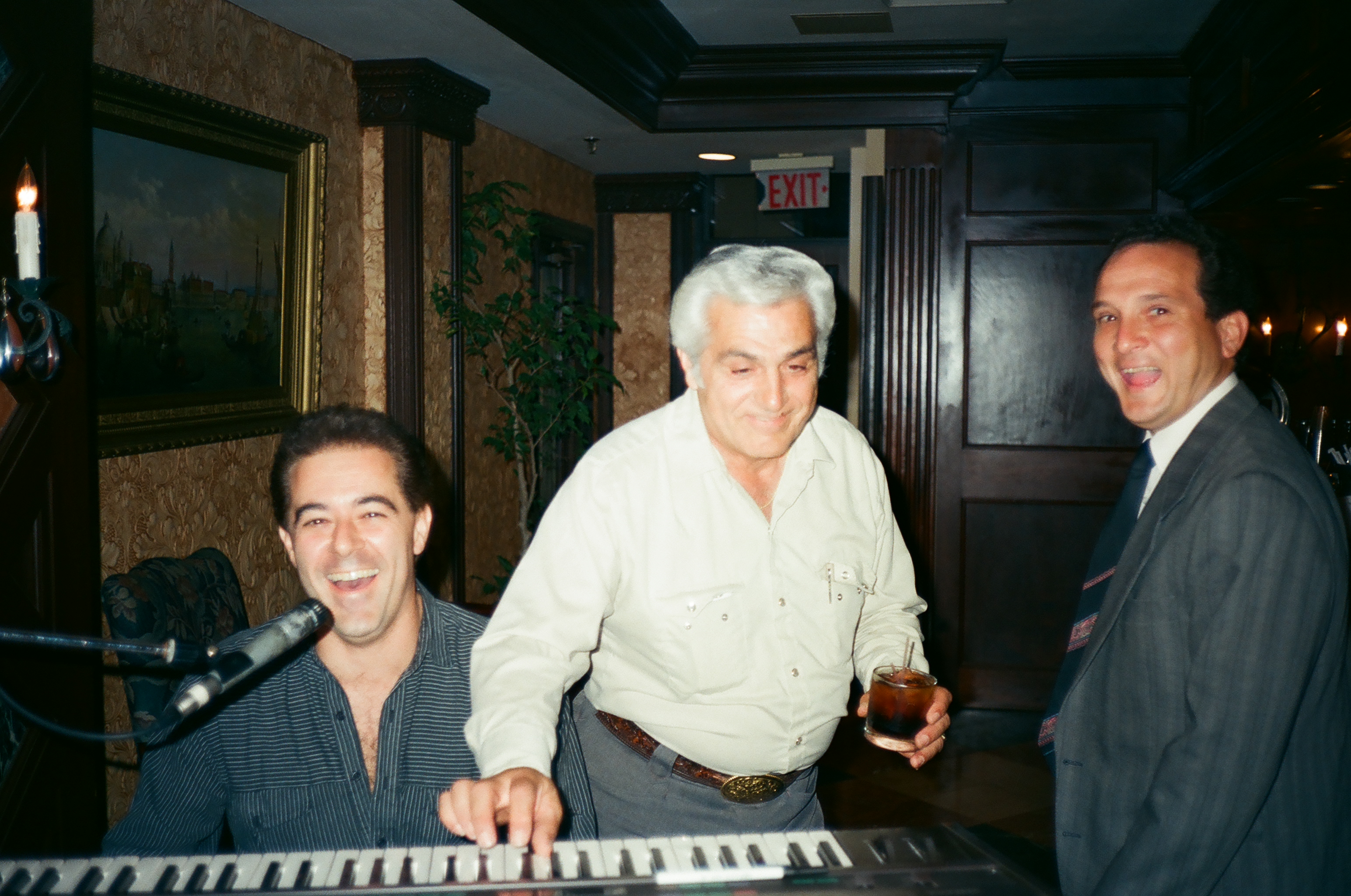 Arrive Alive 1990 Cast wrap party jamming on the keys with the late Johnny Oliver, music coordinator for the Paramount production.