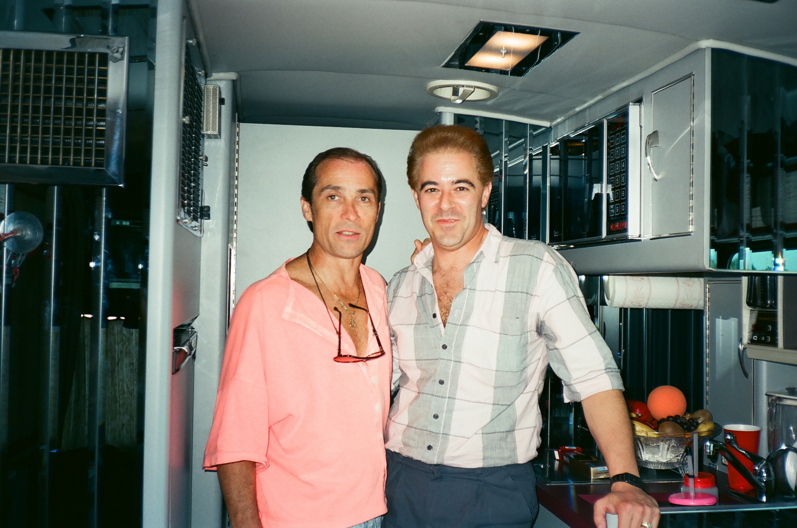 1990 Warren with his friend from his MGM in Reno performing days, Lee Greenwood in his touring bus at a concert in Florida while I was shooting Arrive. Dig the hair color I had in the film.
