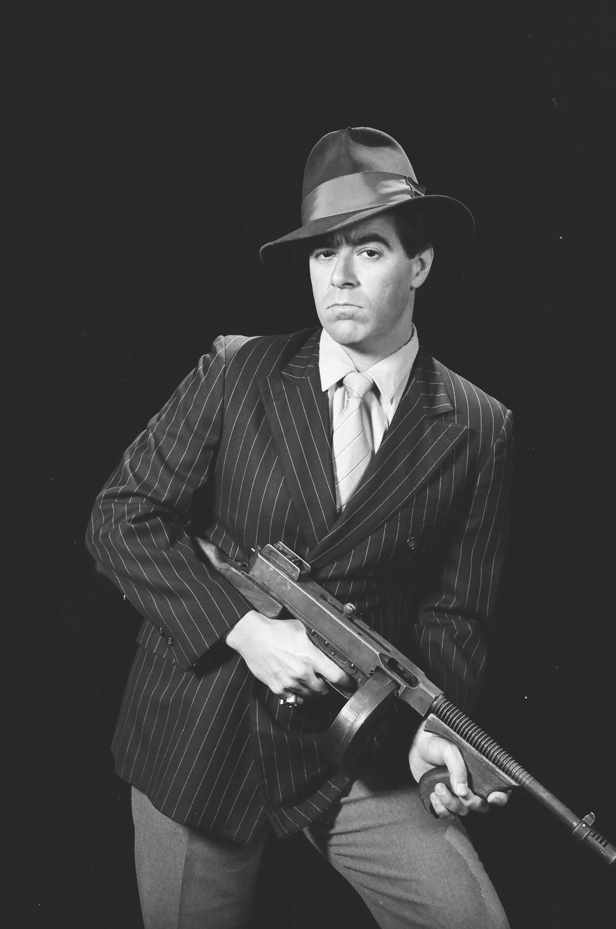 Warren portraying a mobsters with machine gun 1990