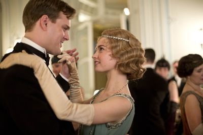 Still of Lily James and Andrew Alexander in Downton Abbey