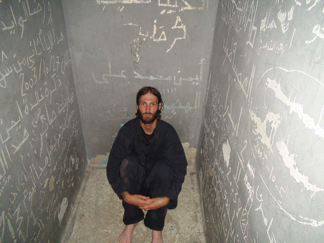 Matthew VanDyke in his prison cell in Tripoli, Libya, where he was held as a prisoner of war during part of the Libyan Civil War in 2011 before escaping from prison and returning to combat on the front lines.