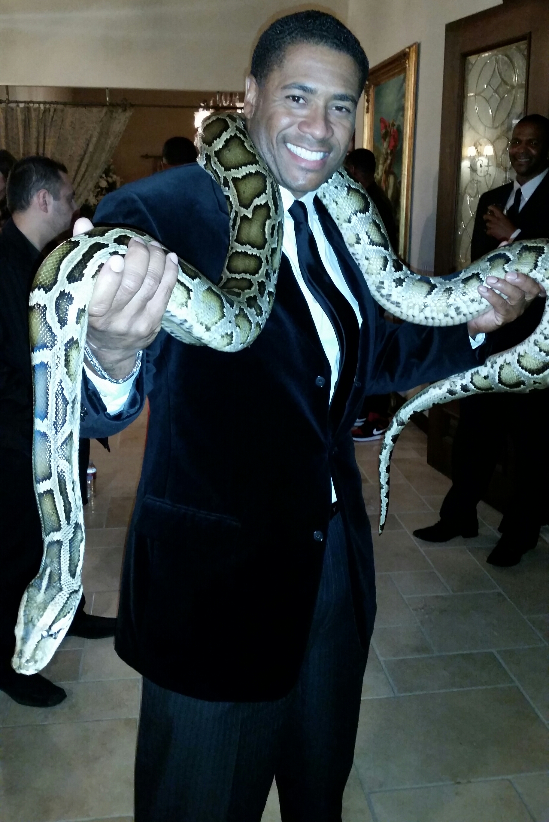 Adonis the Burmese Python and Mandell Frazier on set for Jackie Christie's 