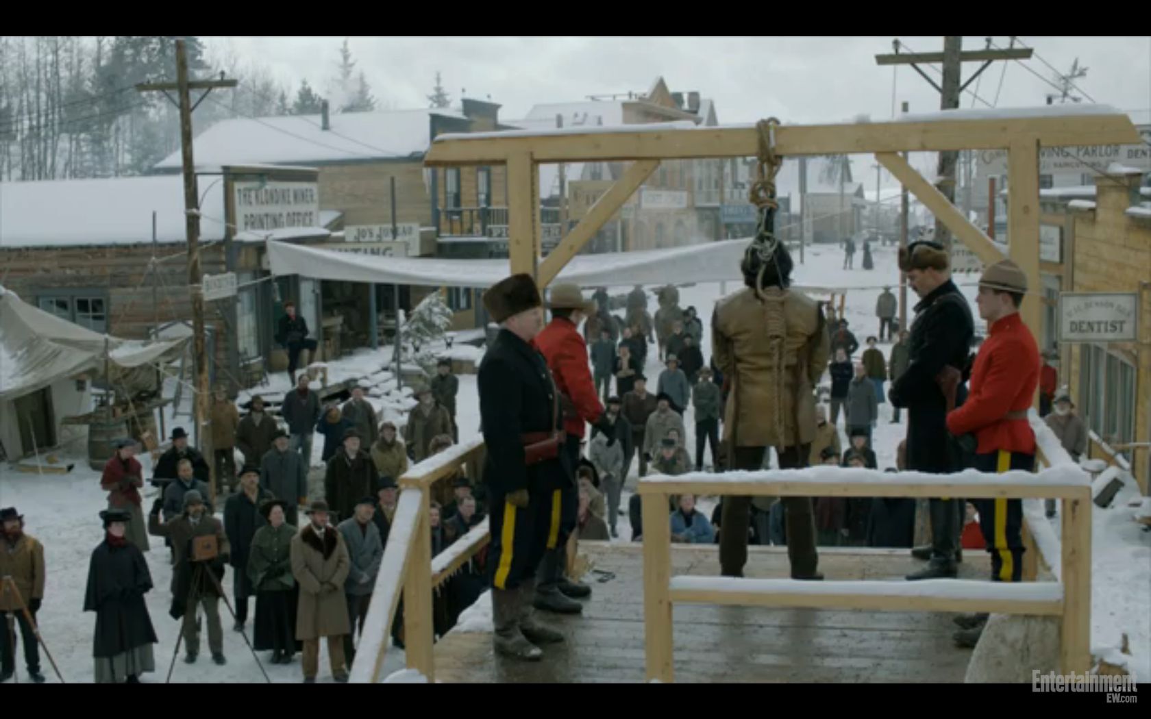 Terry A. Brown (in fur hat) guarding prisoner on the gallows in a scene from Discovery Channel's Klondike.