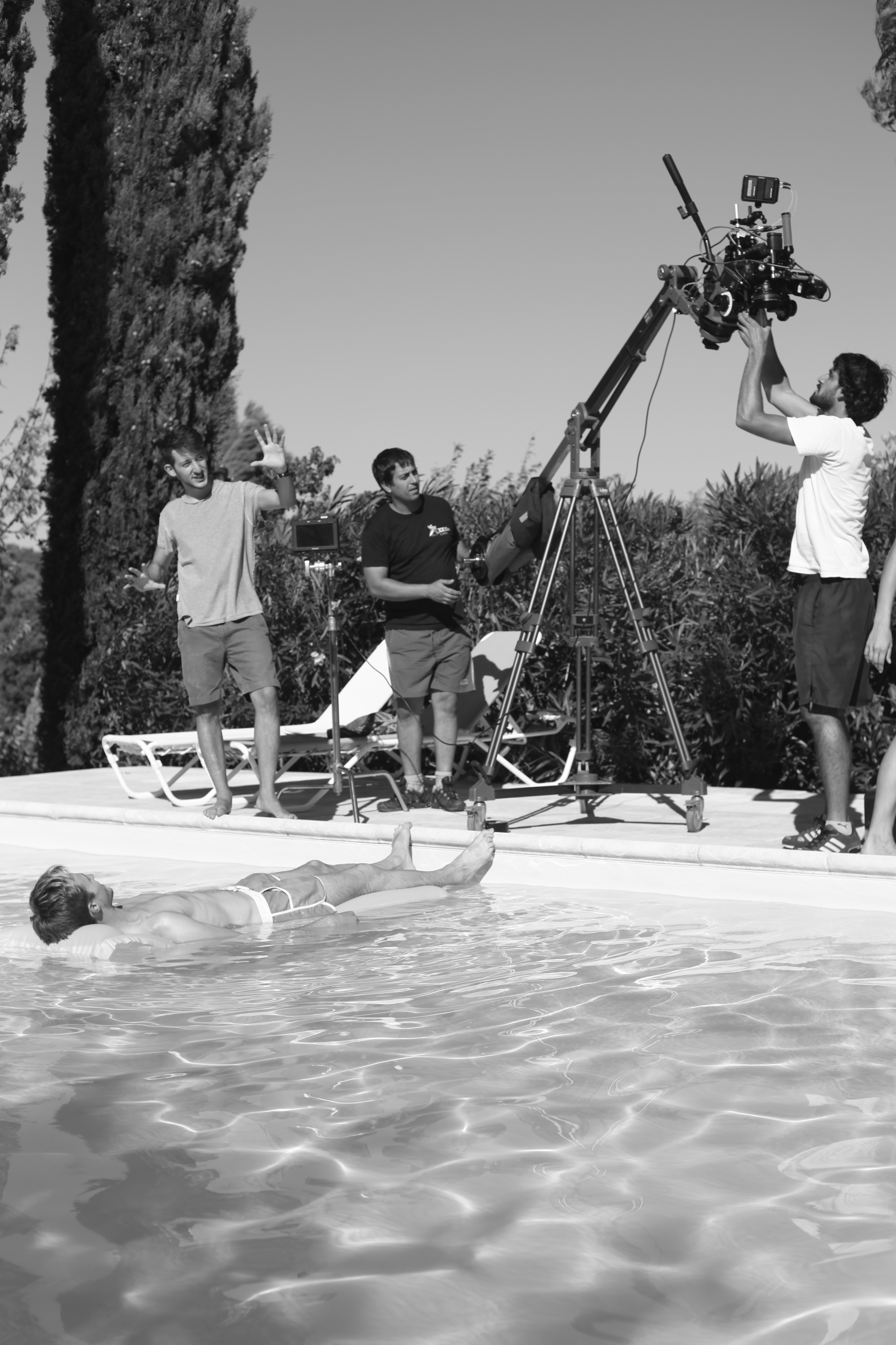 Director Philippe Audi-Dor rehearsing with actor Hugo Bolton as the crew sets up the shot.