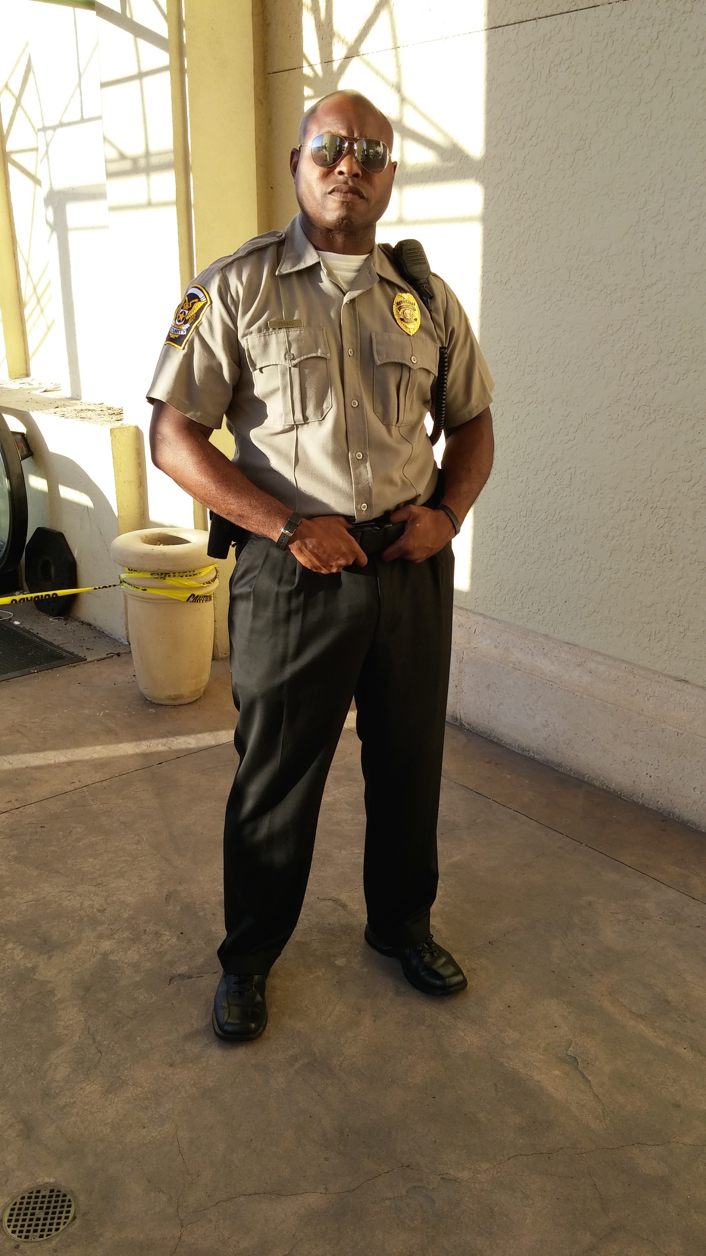 Shante Tasby as security guard on set. (Graceland)