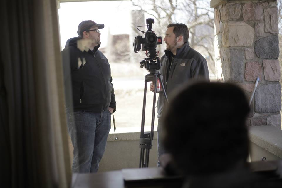 Andy Bisaha disusing a shot with Jacob Chapman on the set of 