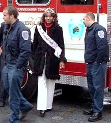 Ms. Pennsylvania 2004 Maria Frisby and firemen at the 2004 Harrisburg Holiday Parade.