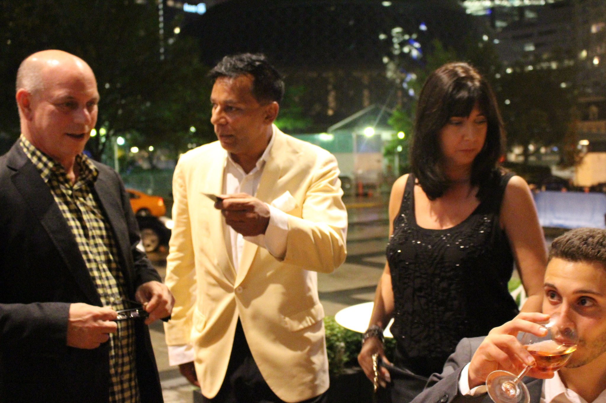 Enjoying a glass of wine at the Bowie Table on the patio of the Ritz Carlton during Toronto International Film Festival with Timothy Hwd Khan and some friends