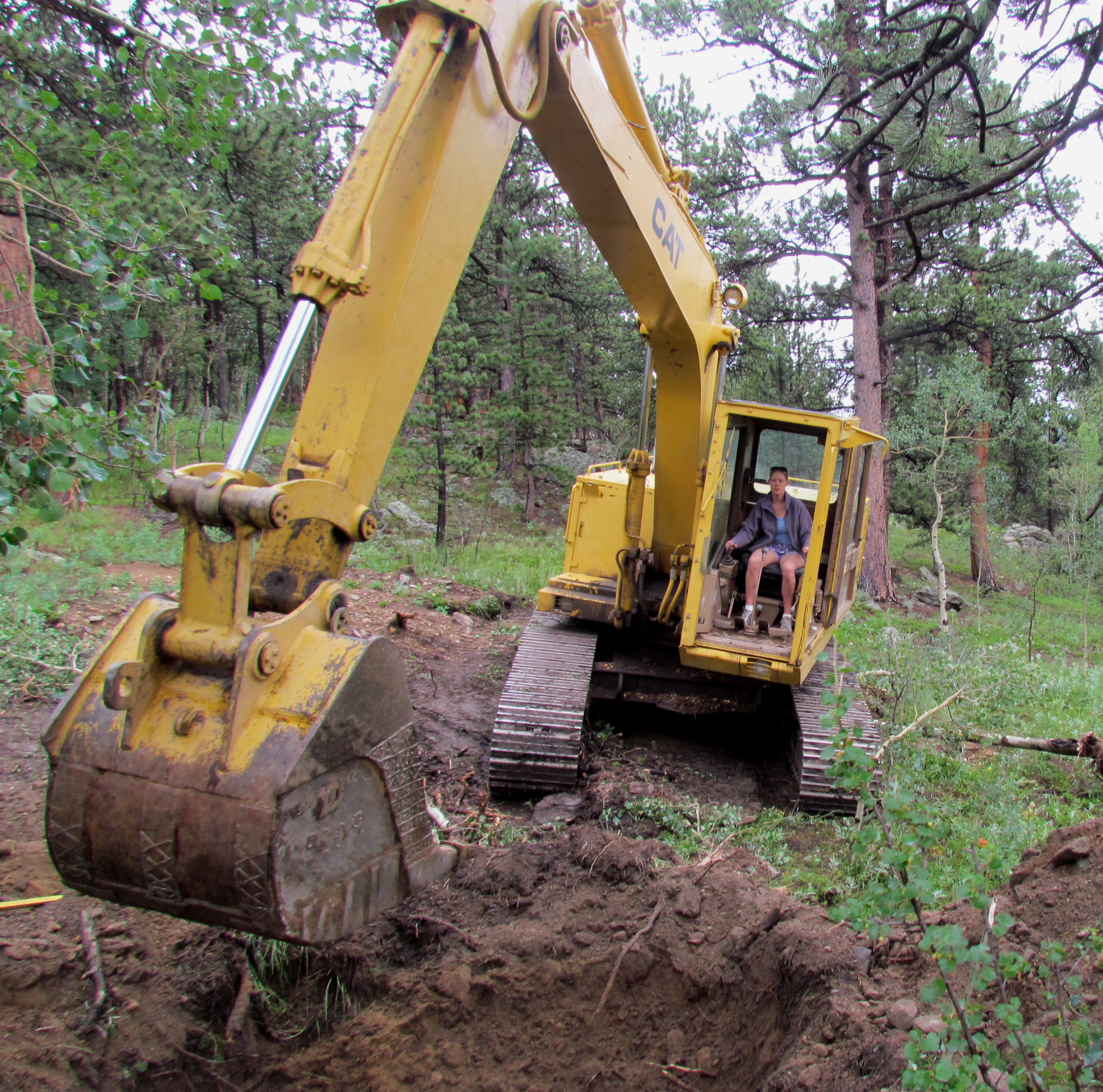 Joanna using a CAT 215. A 20 ton excavator.