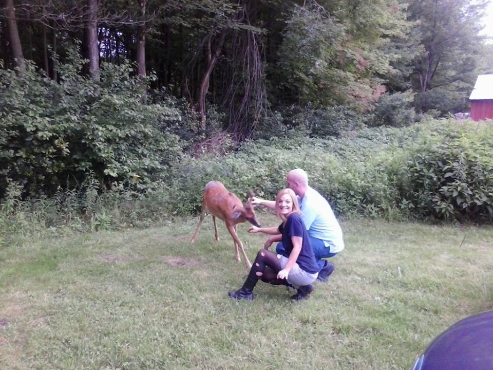 Still of Michael Hackworth and Ali Ferda meeting a deer on the set of 'The Sickness.'