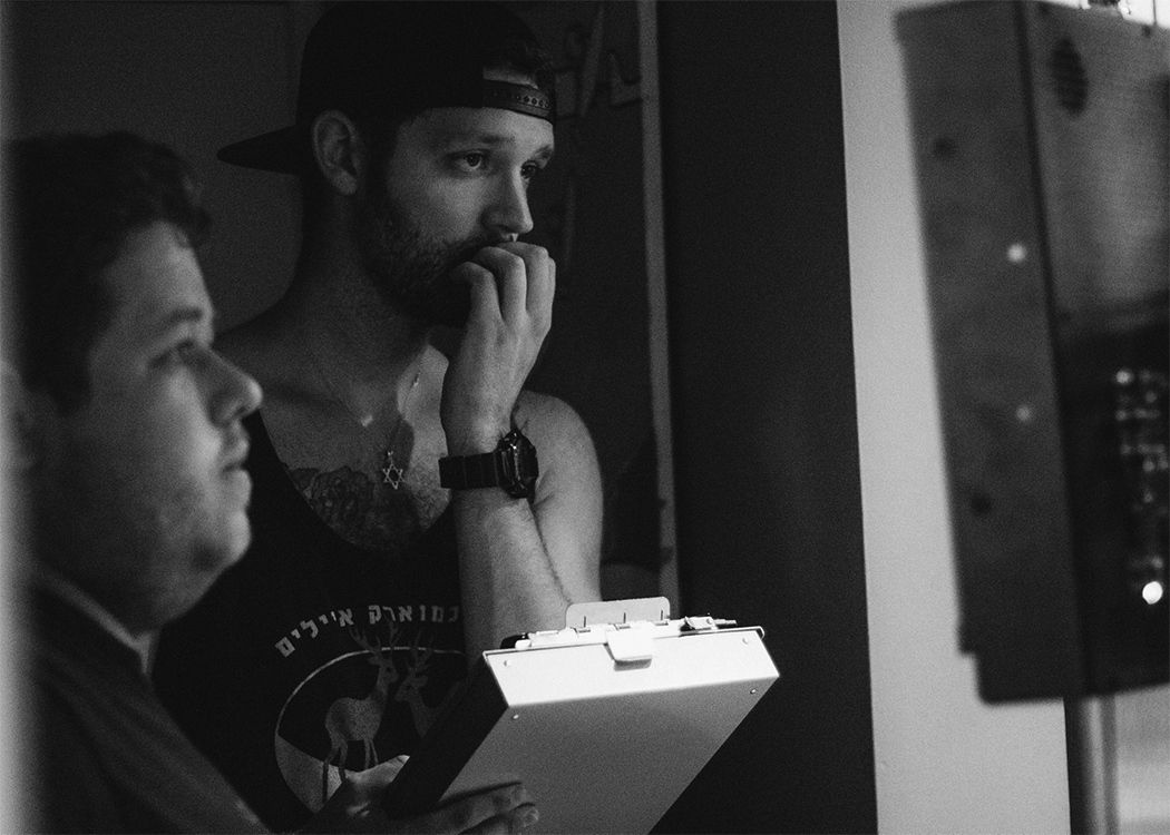 Steven Hayes watches a take on the production monitor alongside Parallax Director Bram Cole