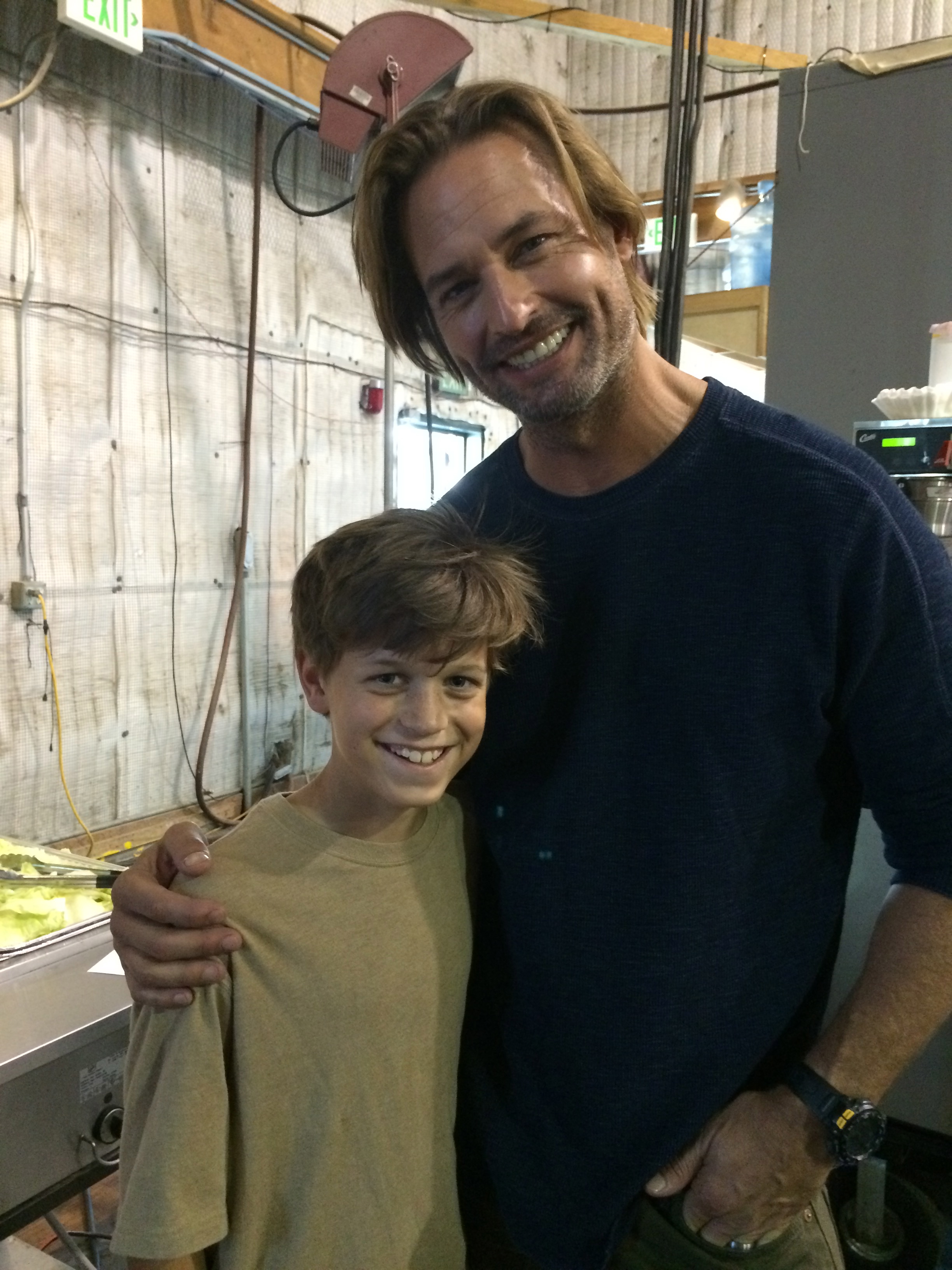 Jacob Buster (Charlie Sullivan) with Josh Holloway on the set of COLONY